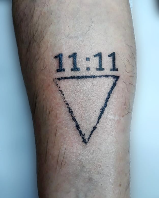 11:11 tattoo with a triangle